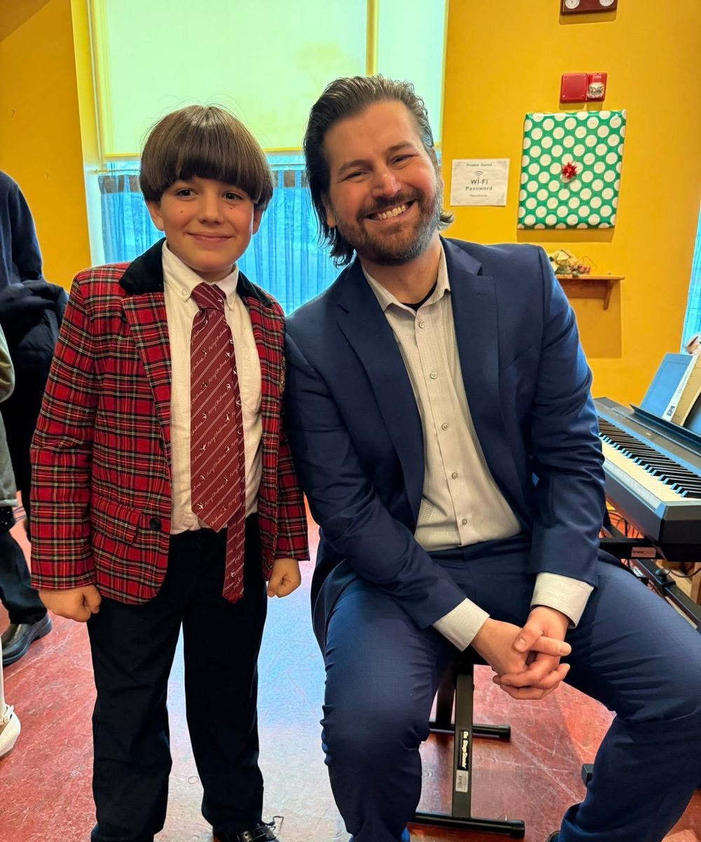 Michael with a student at a recital