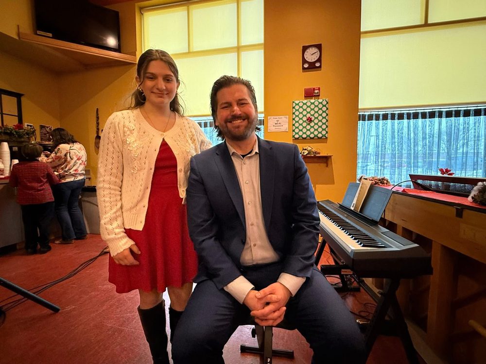 Michael with a student at a holiday recital